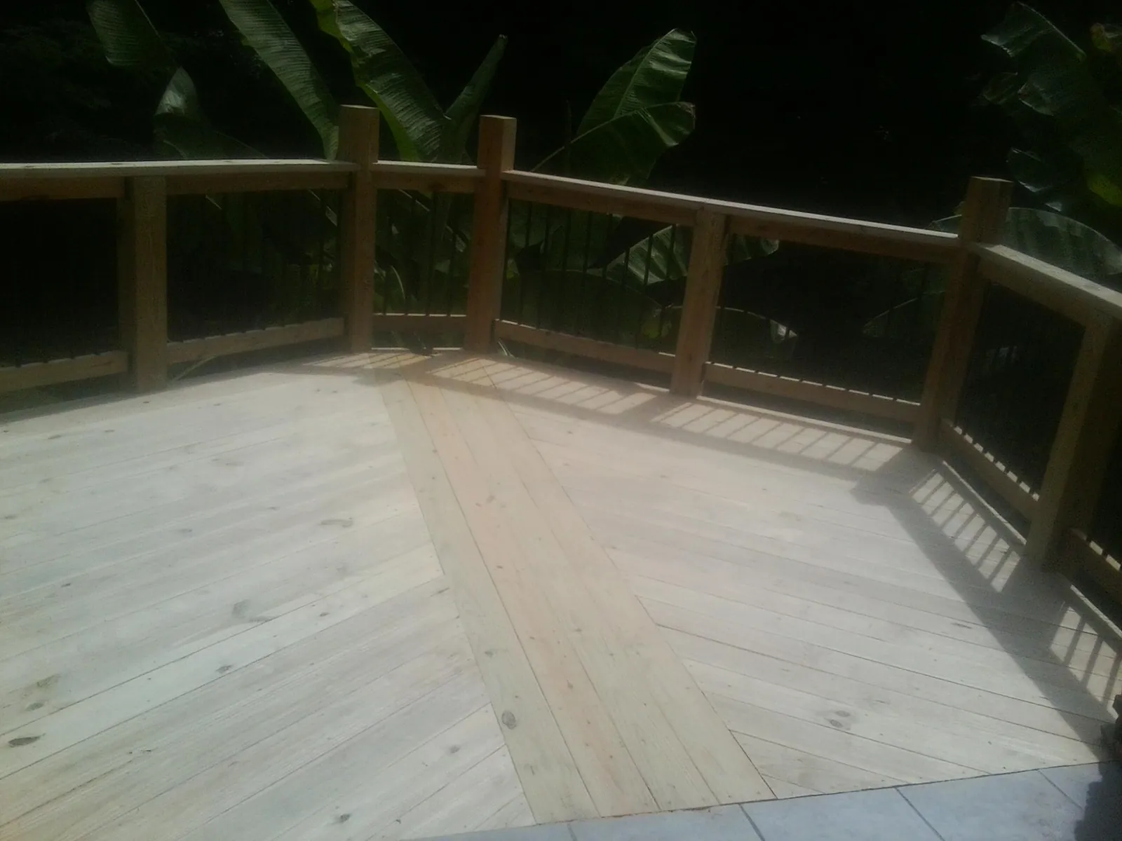 New wood deck and railing built off the back of a home in El Cajon